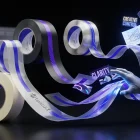 Whirling OpenAI-branded tape morphs into images, clear text, UI, and posters in creative studio